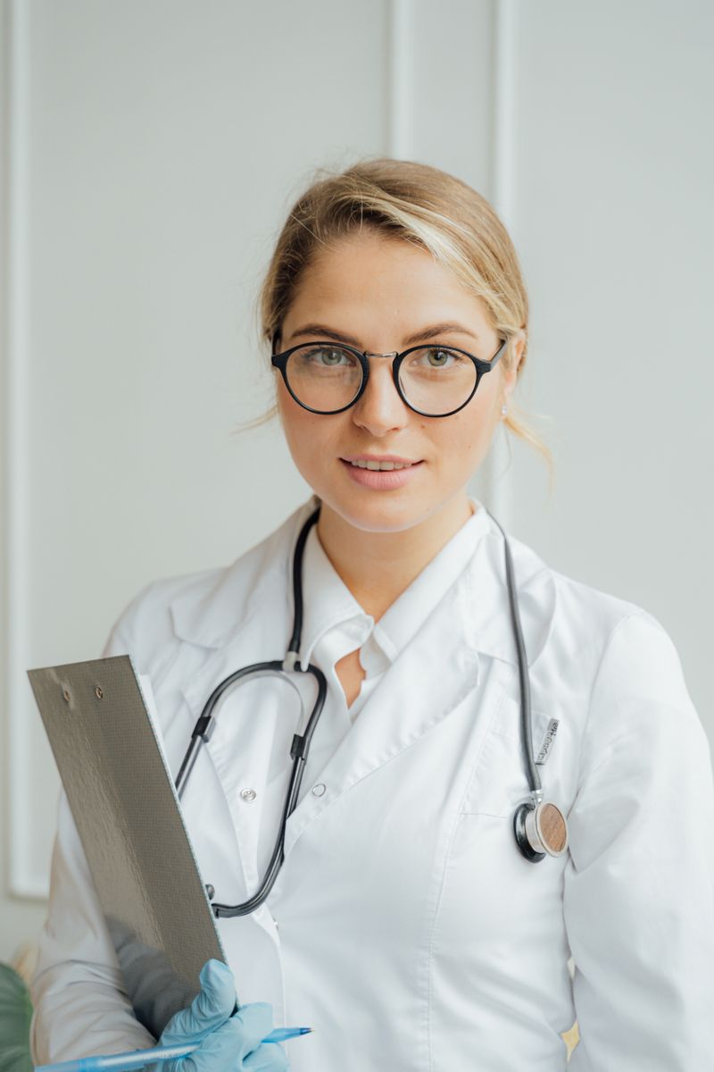 A clinician holding a clipboard and stethoscope